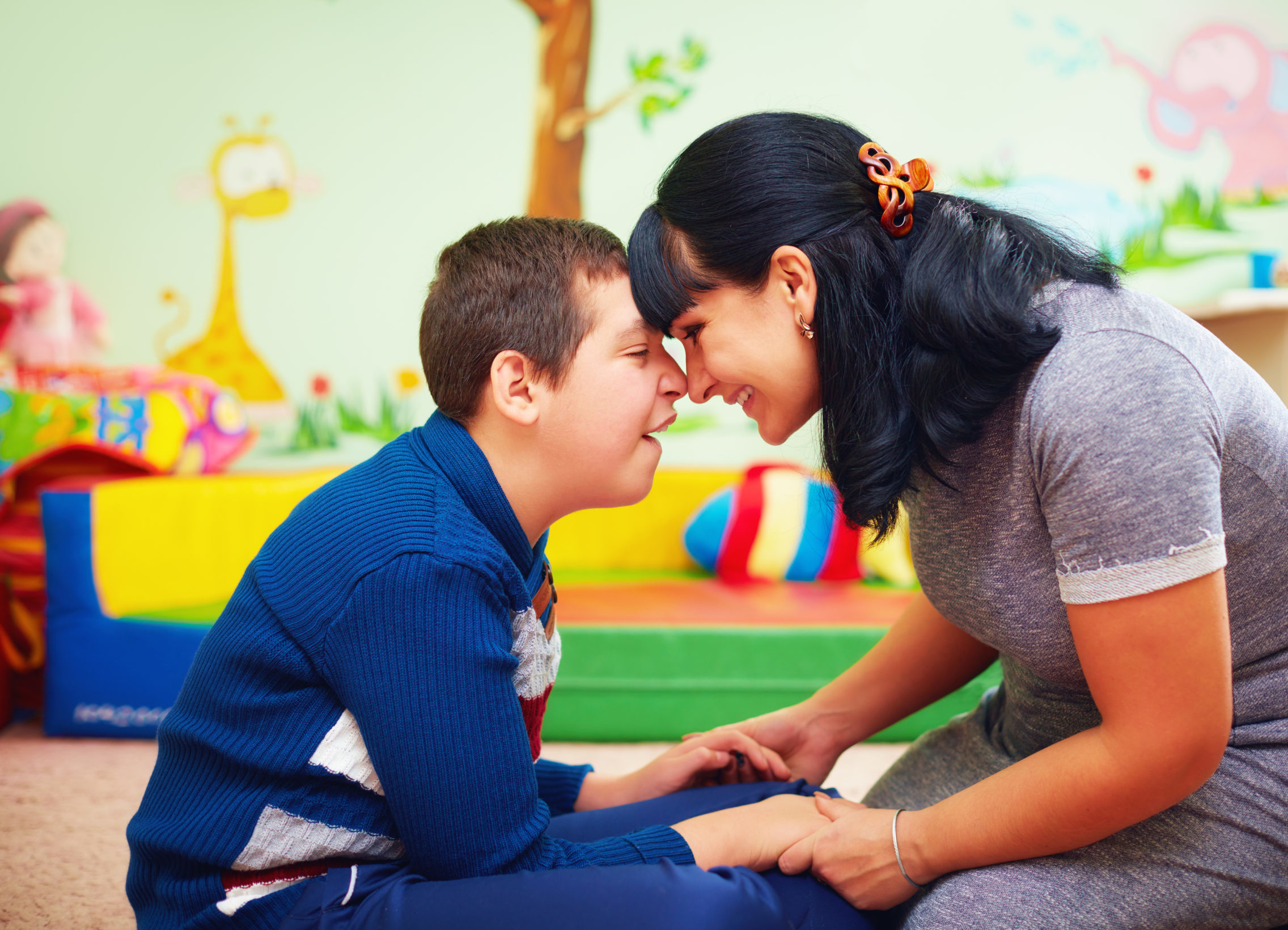soulful moment, portrait of mother and her beloved son with disability in rehabilitation center