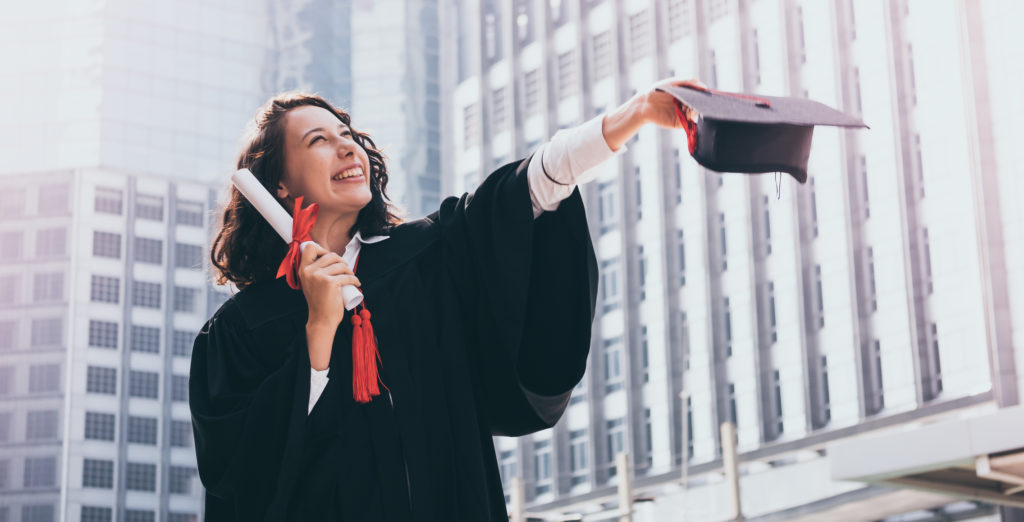 woman with graduation cap and gown