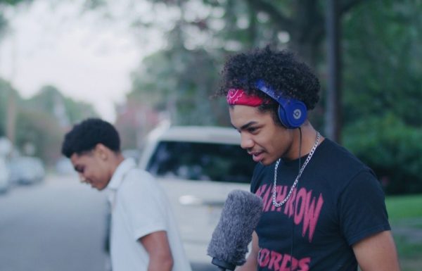 man recording with microphone