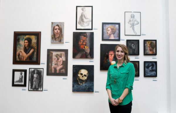woman with art exhibit
