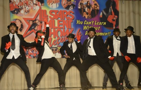young men performing in talent show