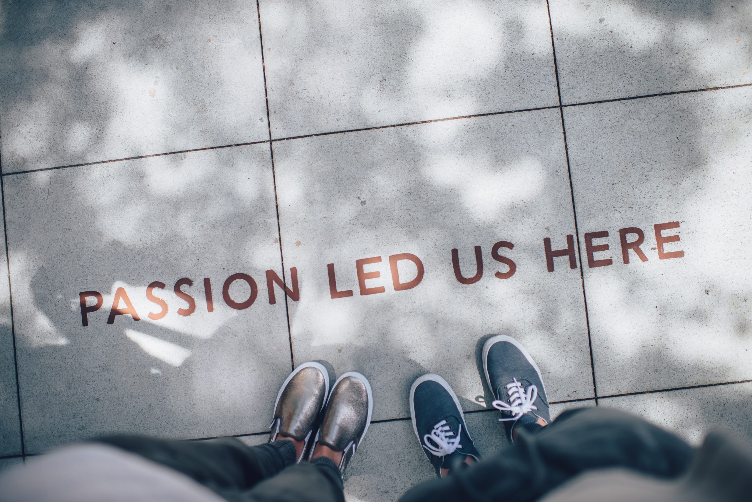'Passion led us here' written on sidewalk
