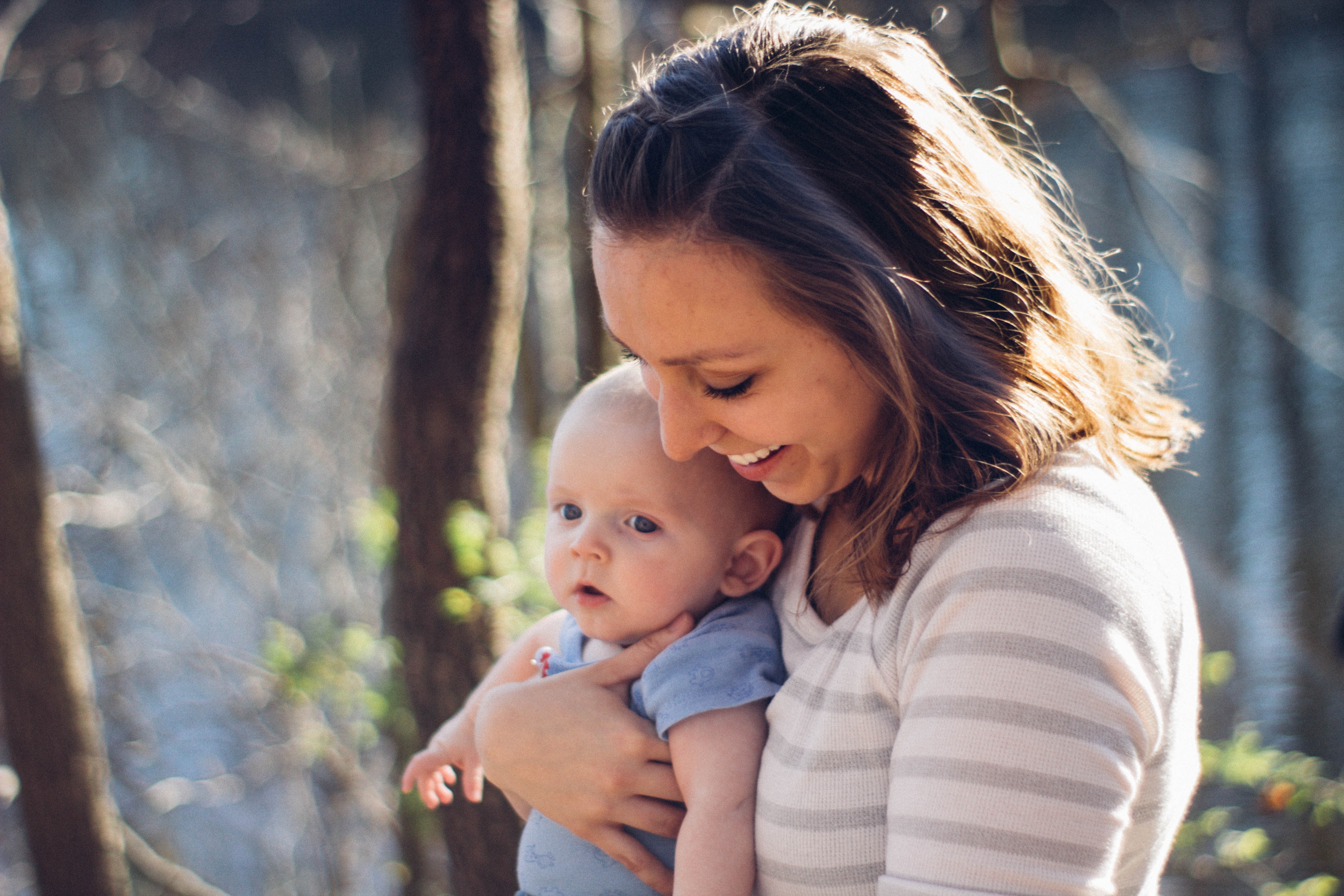 mom holding young child