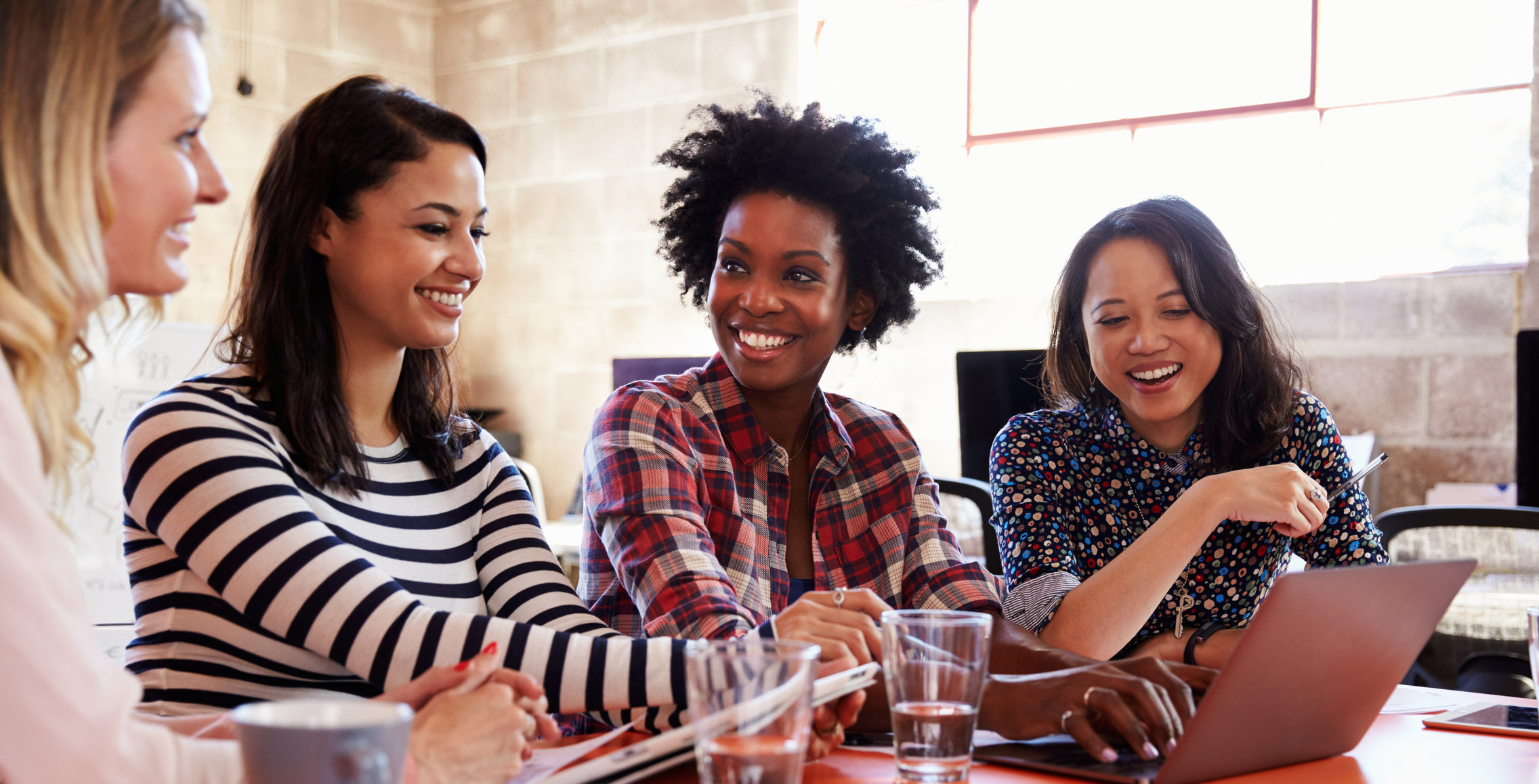 four woman working together