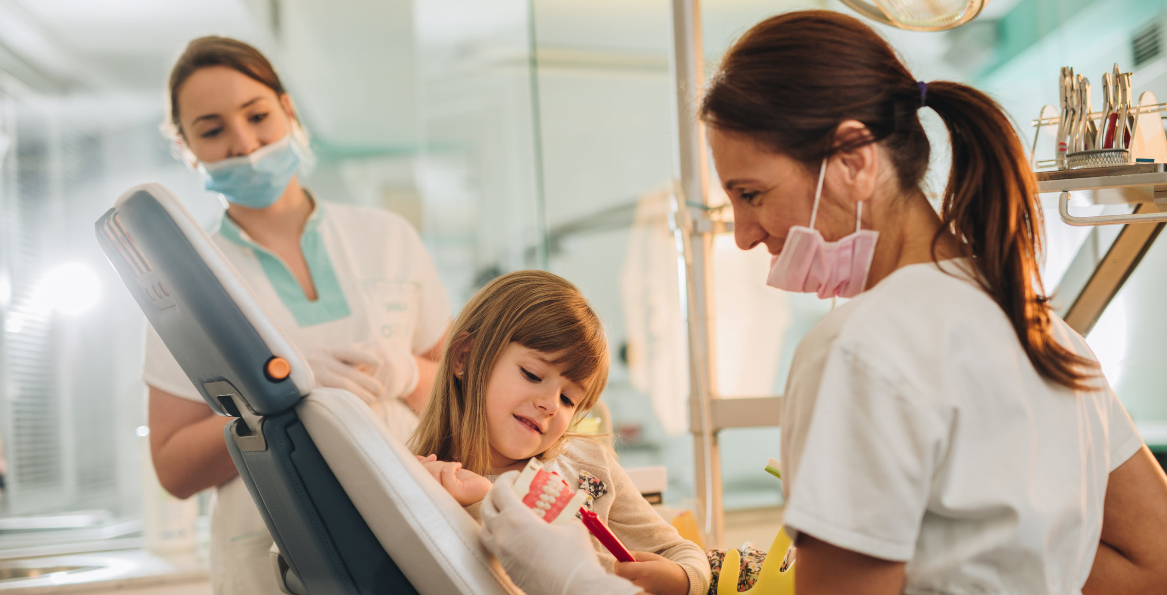 female dentist with little girl