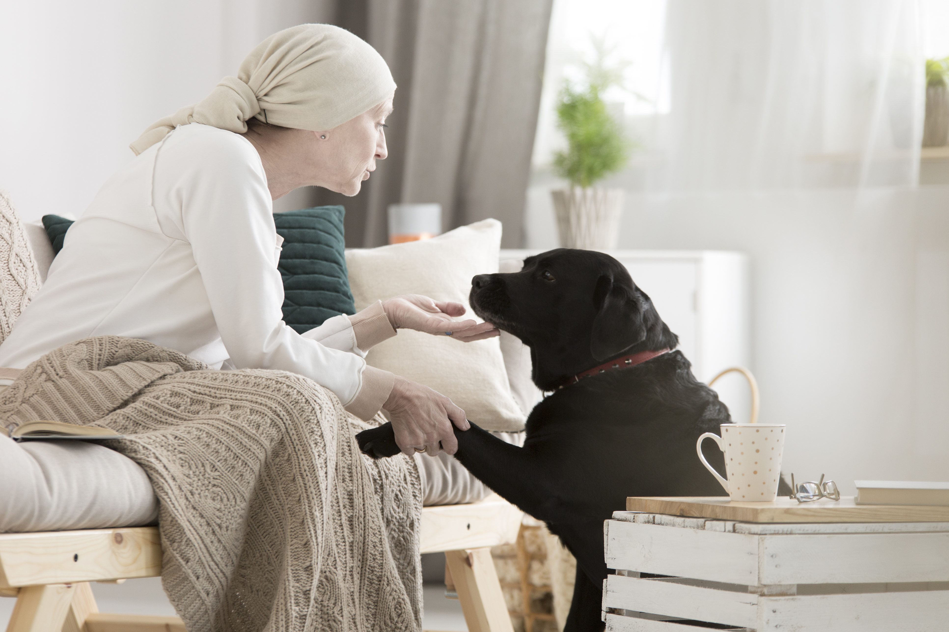 woman with cancer with her dog
