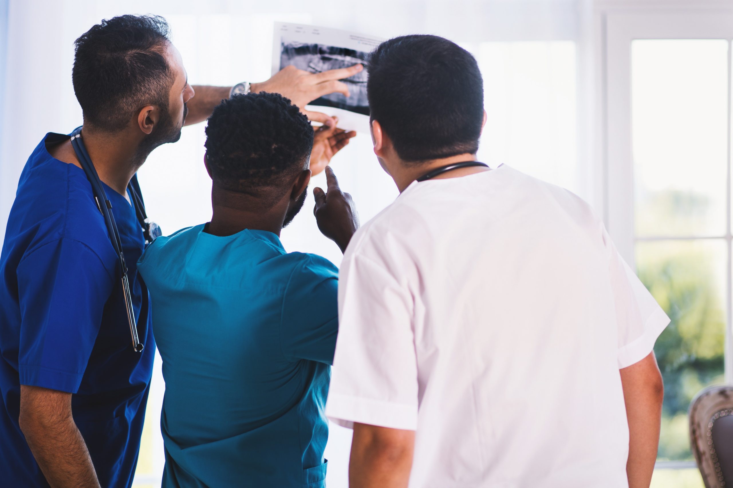 doctors looking at x-ray in hospital