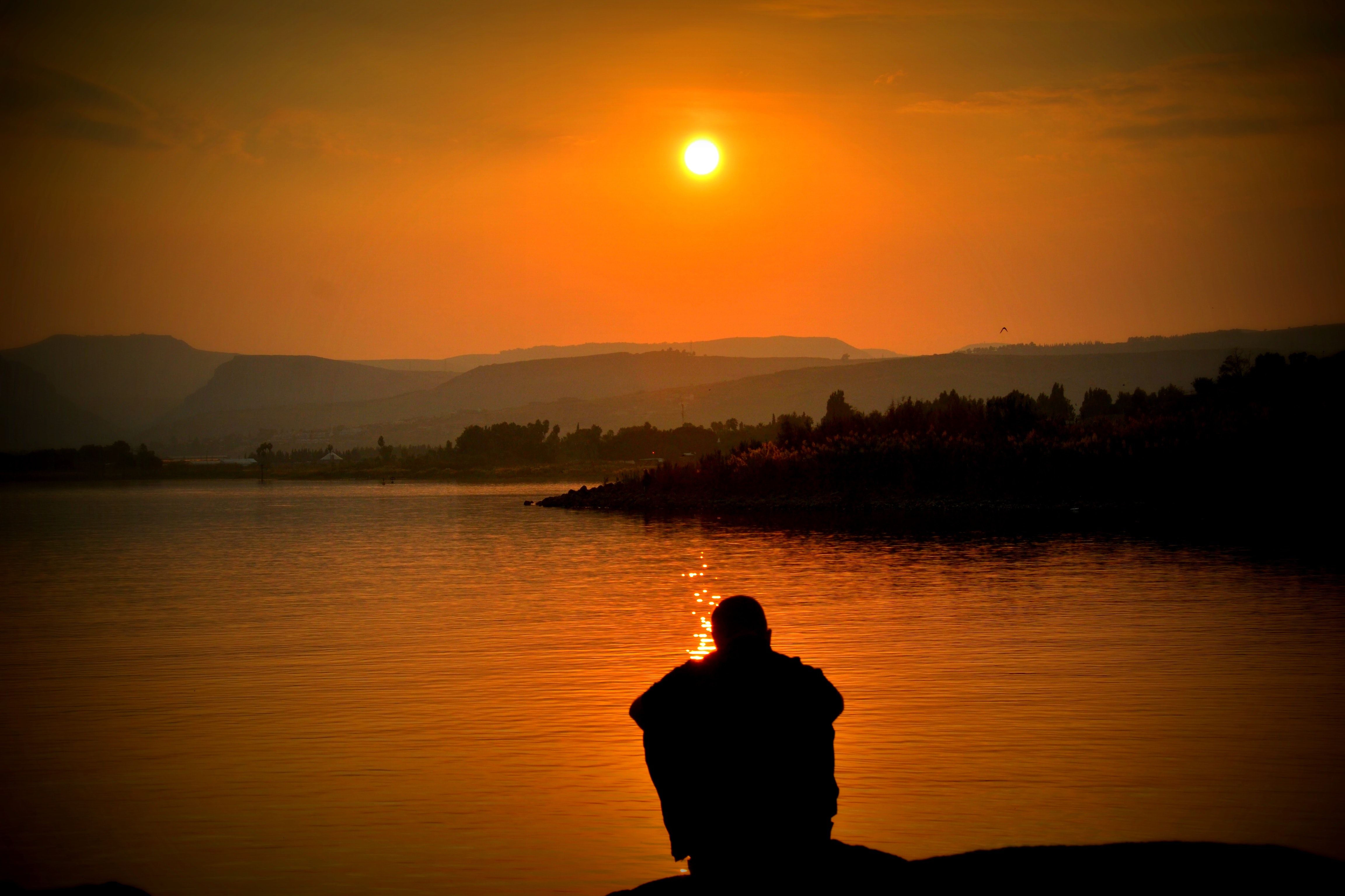 Man looking at a sunset