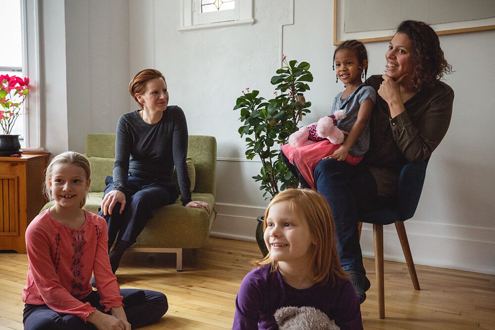 four young girls and their mom