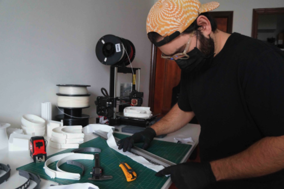 man in black shirt building a face shield