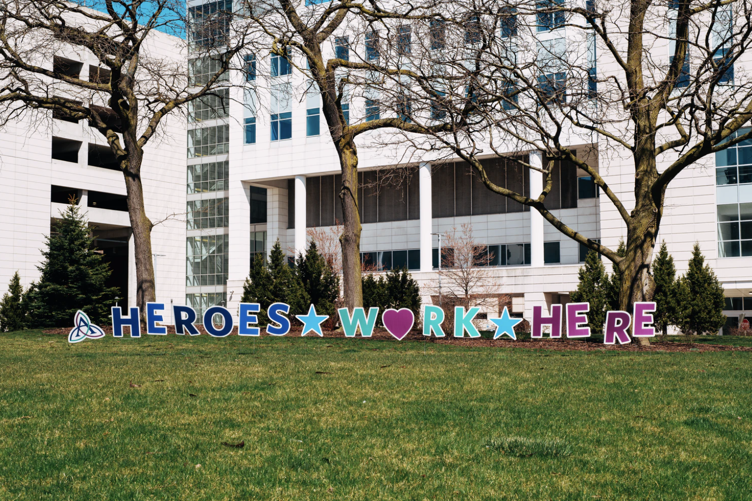 heroes work here sign in front of a hospital