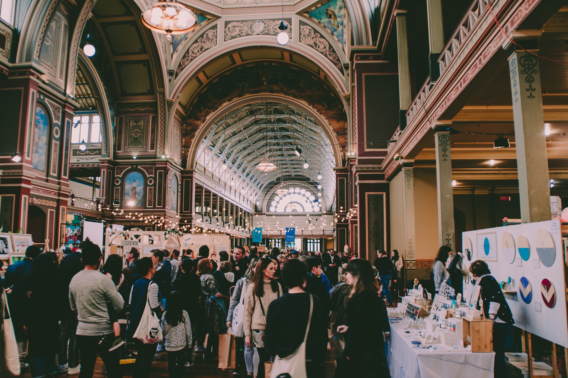 crowd of people in a large open hall for an event