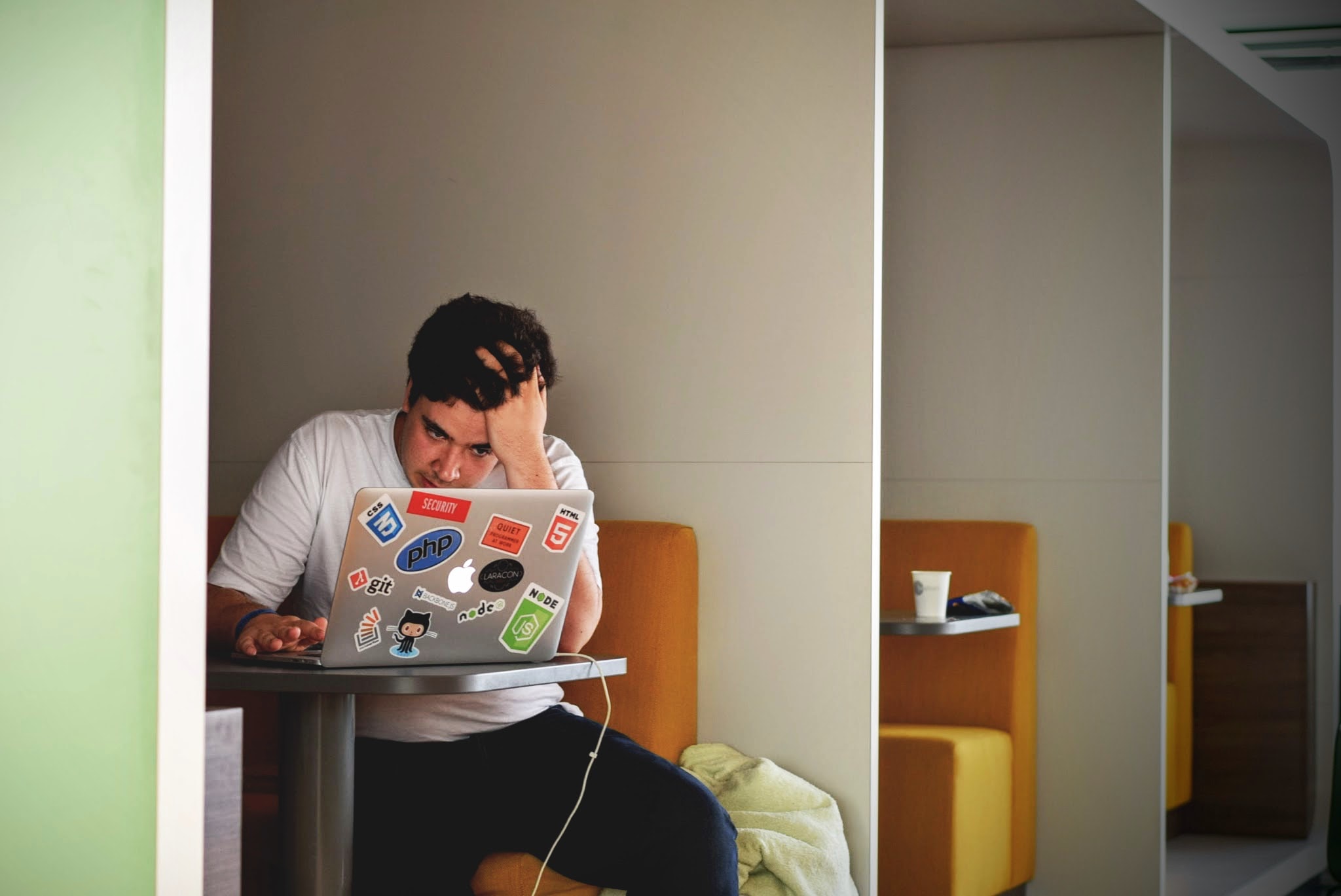man sitting at computer