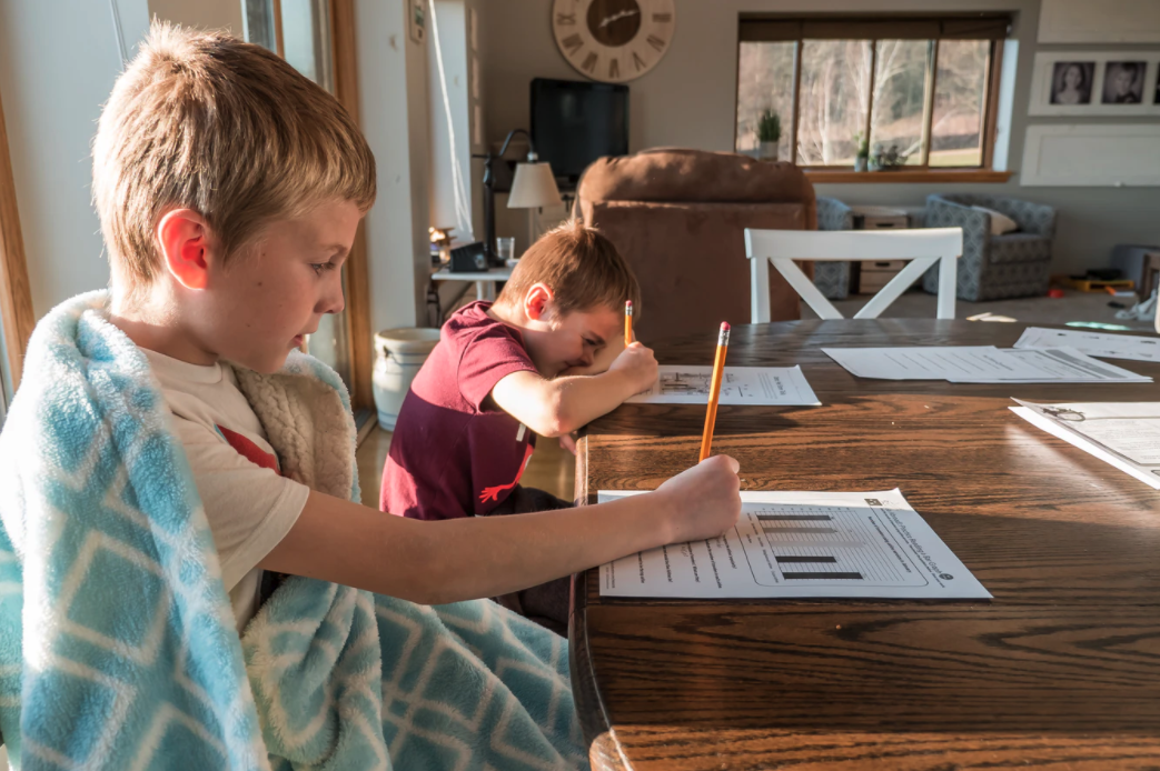 two boys doing homework