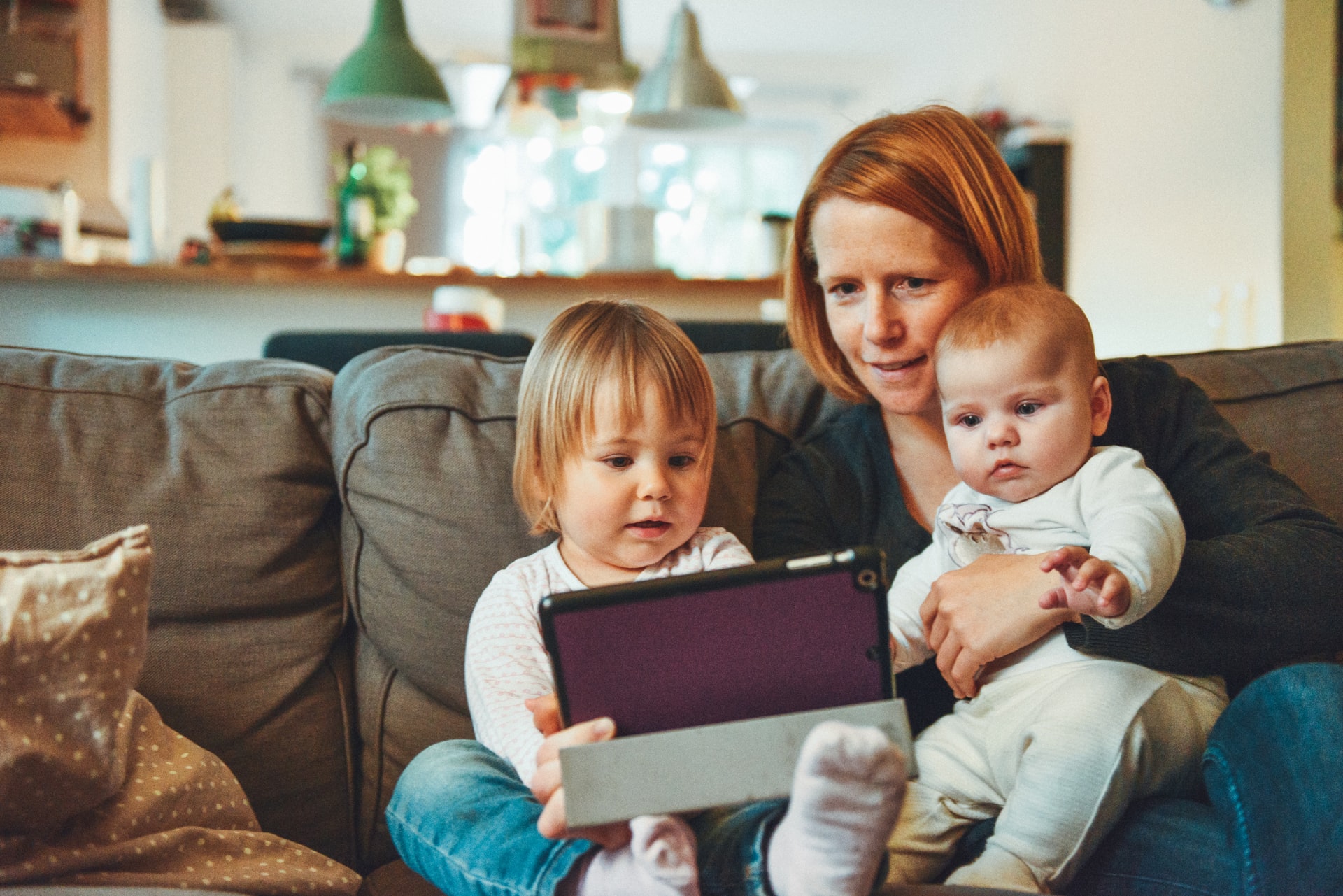 mother reading to her two children