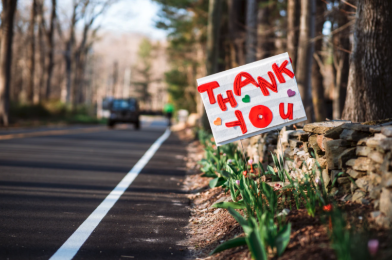 thank you sign for essential workers on the side of the road