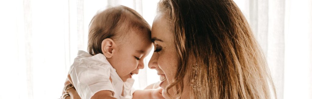 mother holding baby