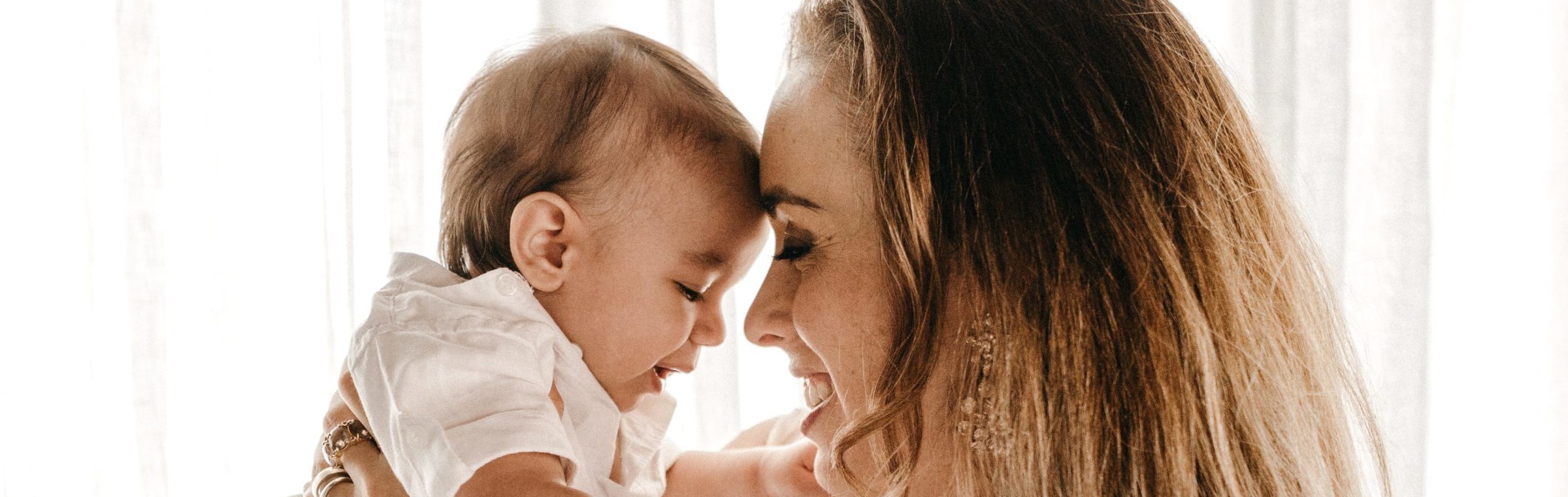 mother holding baby