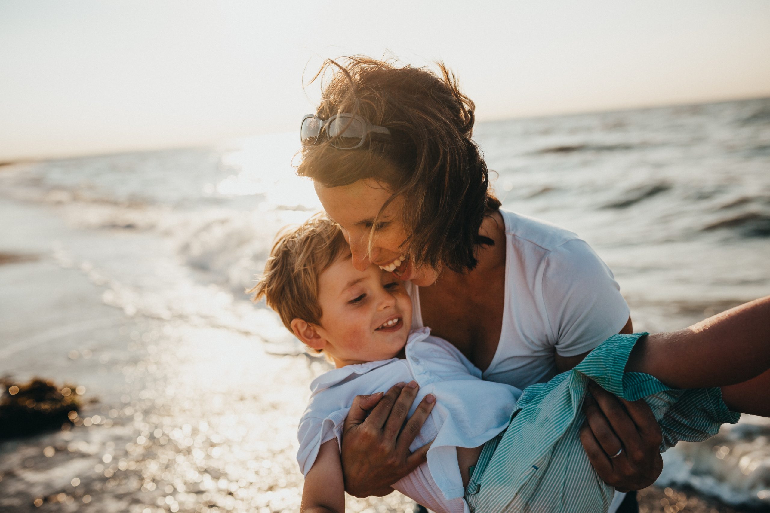 woman hugging toddler